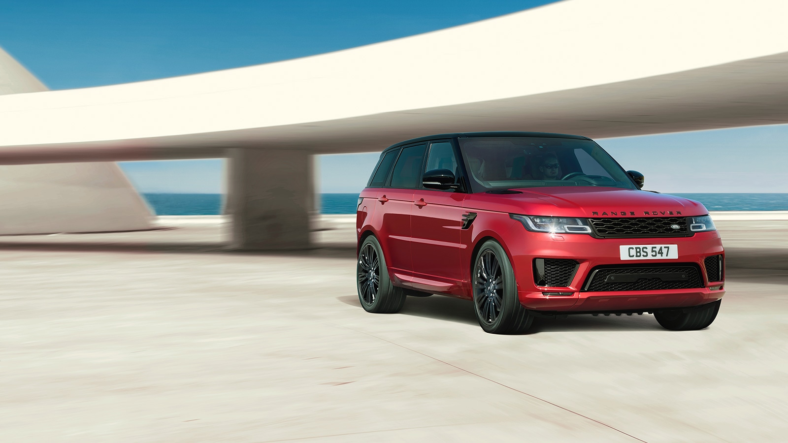 red LAND ROVER SPORT front angular view