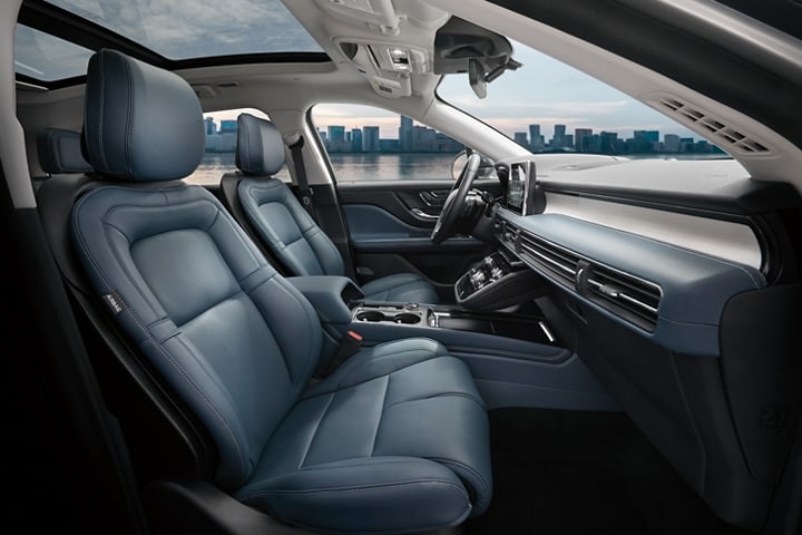The blue front seats of the Lincoln MKC with the sea view