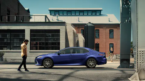 dark blue 2021 toyota camry in the city