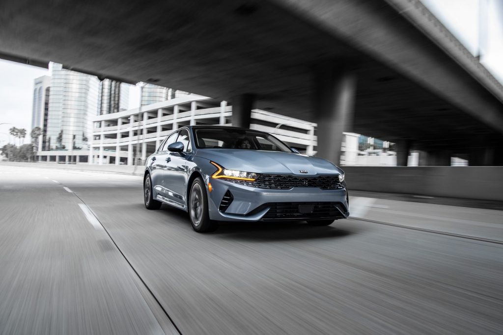 2021 kia k5 in the motion on the road