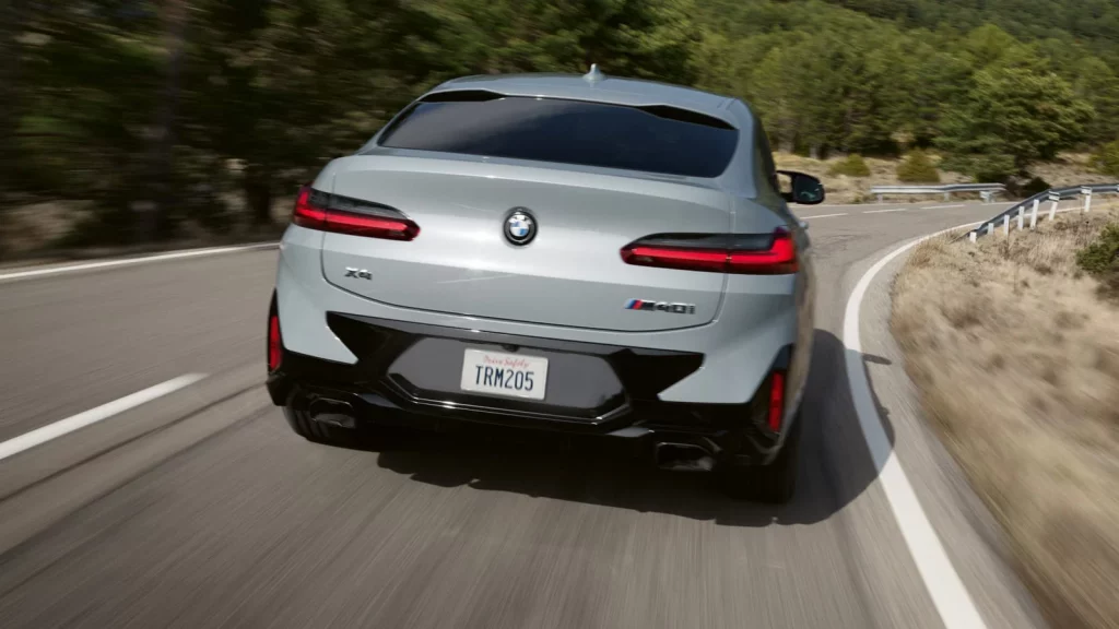 rear view of 2021 bmw x4 in the motion on the highway