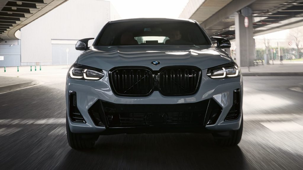 front view 2021 bmw x4 under the bridge in the motion 