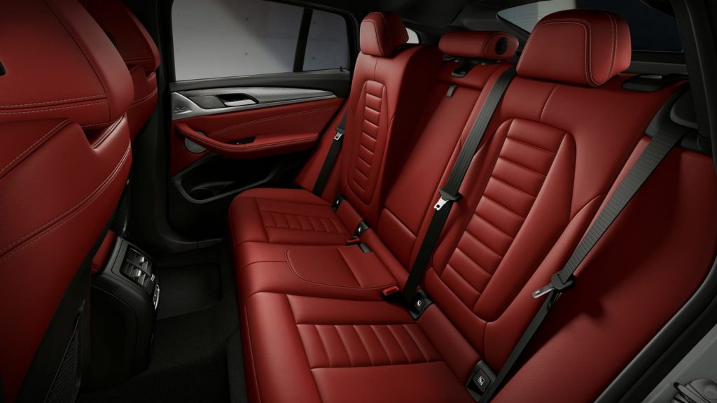 rear seats in red color of 2021 bmw x4
