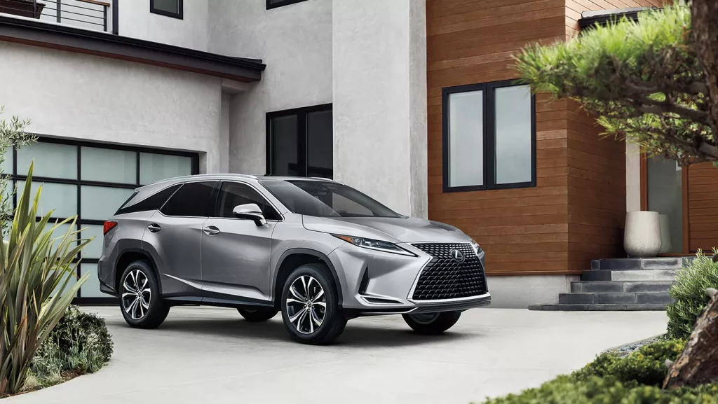front angular view of grey 2021 Lexus RX 350 near the mansion