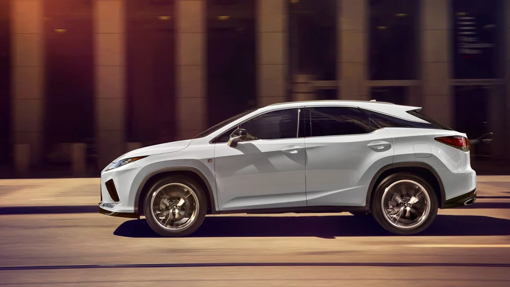 side view of white 2021 Lexus RX 350 in the motion 