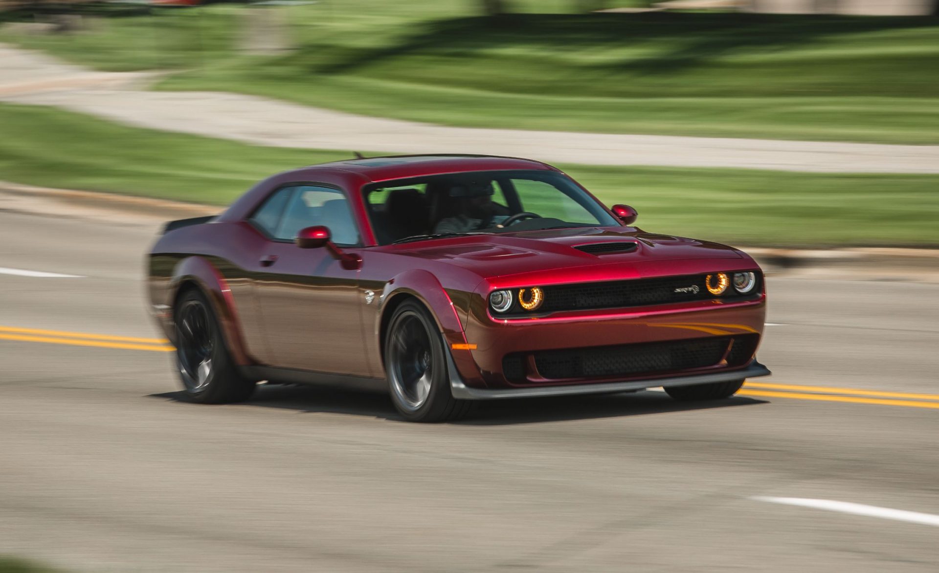 red Dodge Challenger SRT Hellcat Widebody on the road