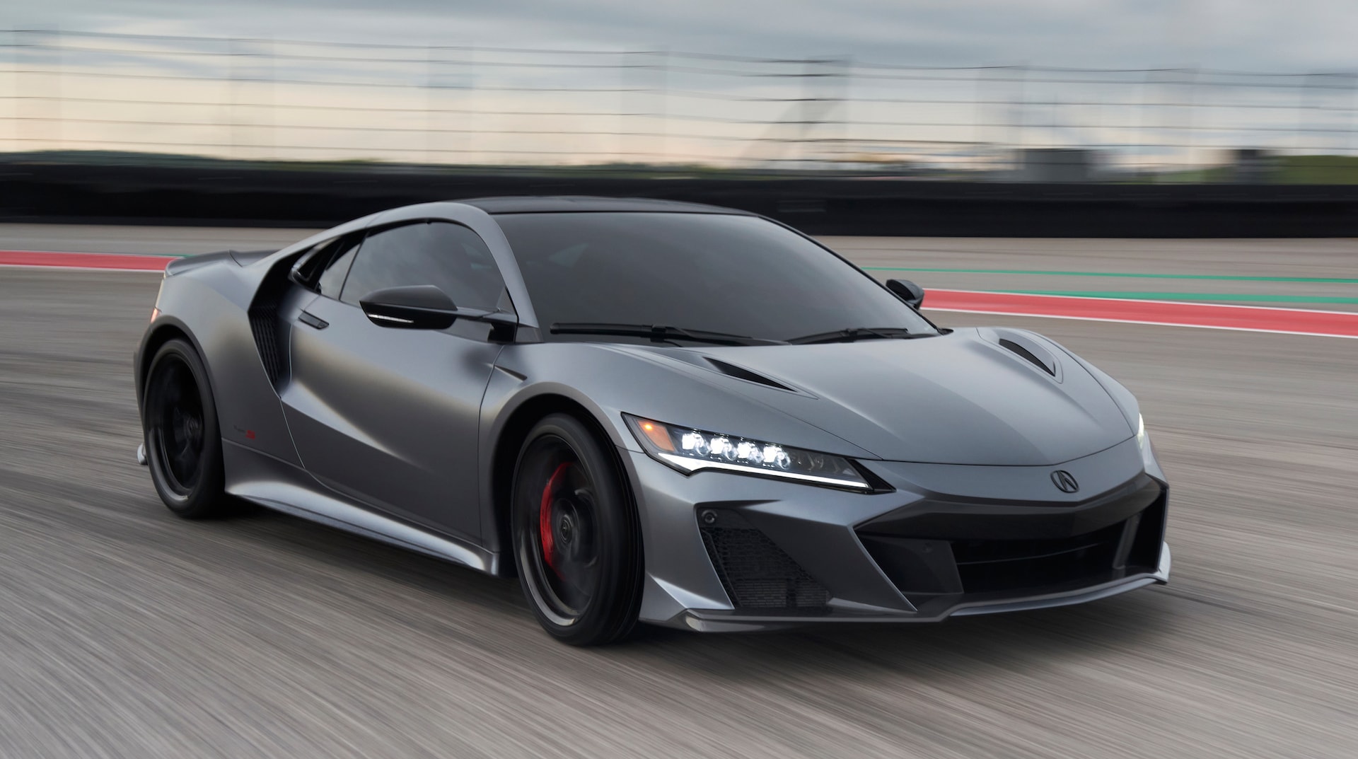 grey Acura NSX front angular view race track