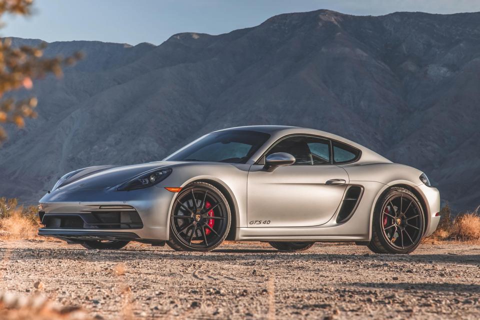 Porsche 718 Cayman GTS 4.0 profile view in the mountain background