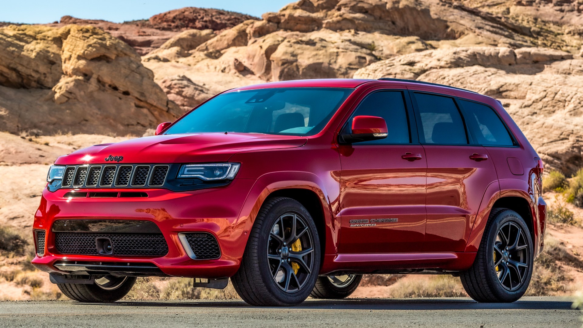 Jeep Grand Cherokee SRT front profile in the mountains