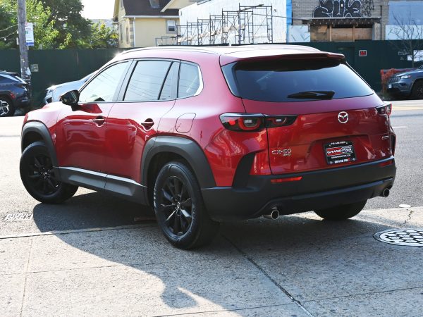 Images of 2025 Mazda CX-50 red exterior, interior, tech dashboard, and side view