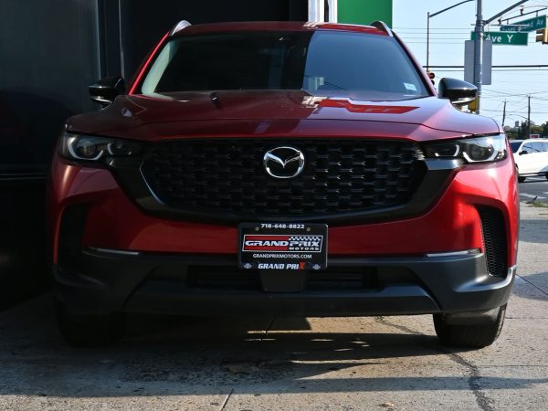 Images of 2025 Mazda CX-50 red exterior, interior, tech dashboard, and side view