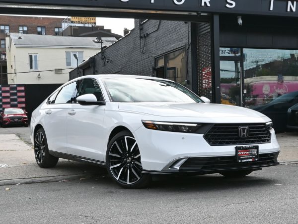 Front three-quarter view of the 2025 Honda Accord with LED headlights and gloss-black grille.