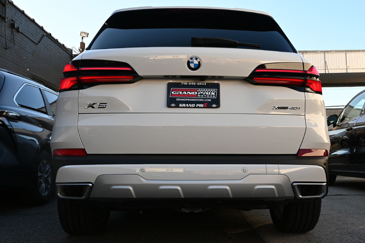 Grand Prix Motors dealership in New York offering BMW X5 lease specials.
